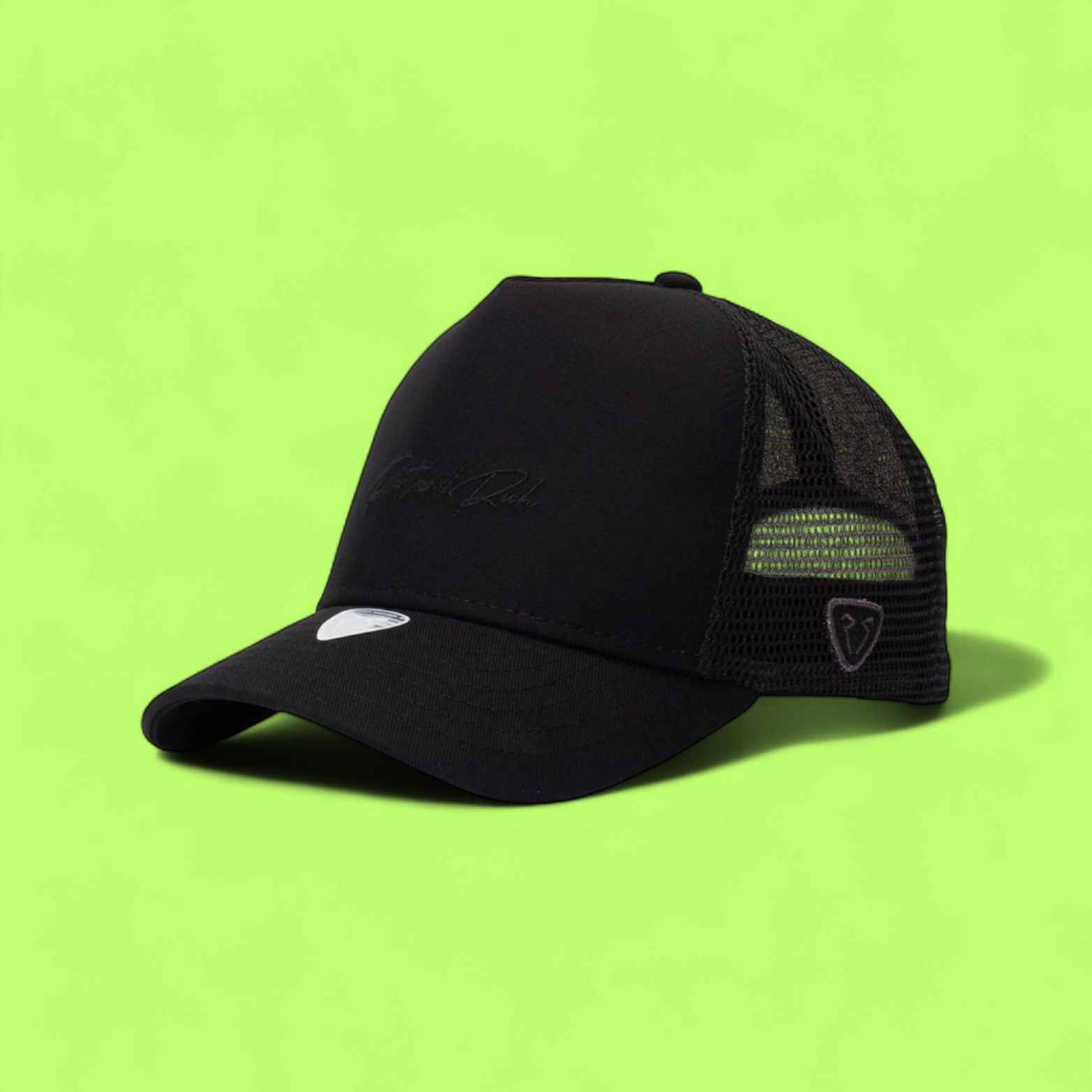BLACK TRUCKER CAP WITH MINIMAL TONE ON TONE EMBROIDERY