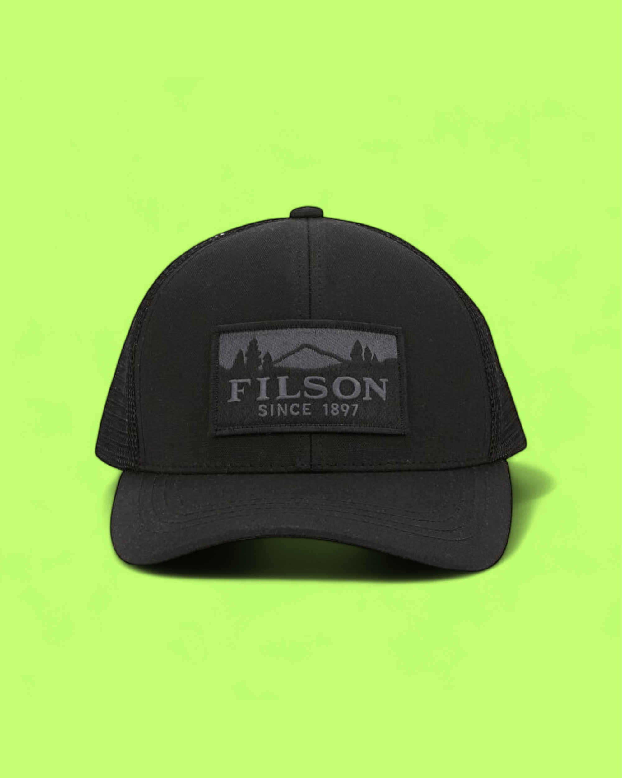 FILSON ALL BLACK OUTDOOR MESH TRUCKER HAT SINCE 1897 LOGO