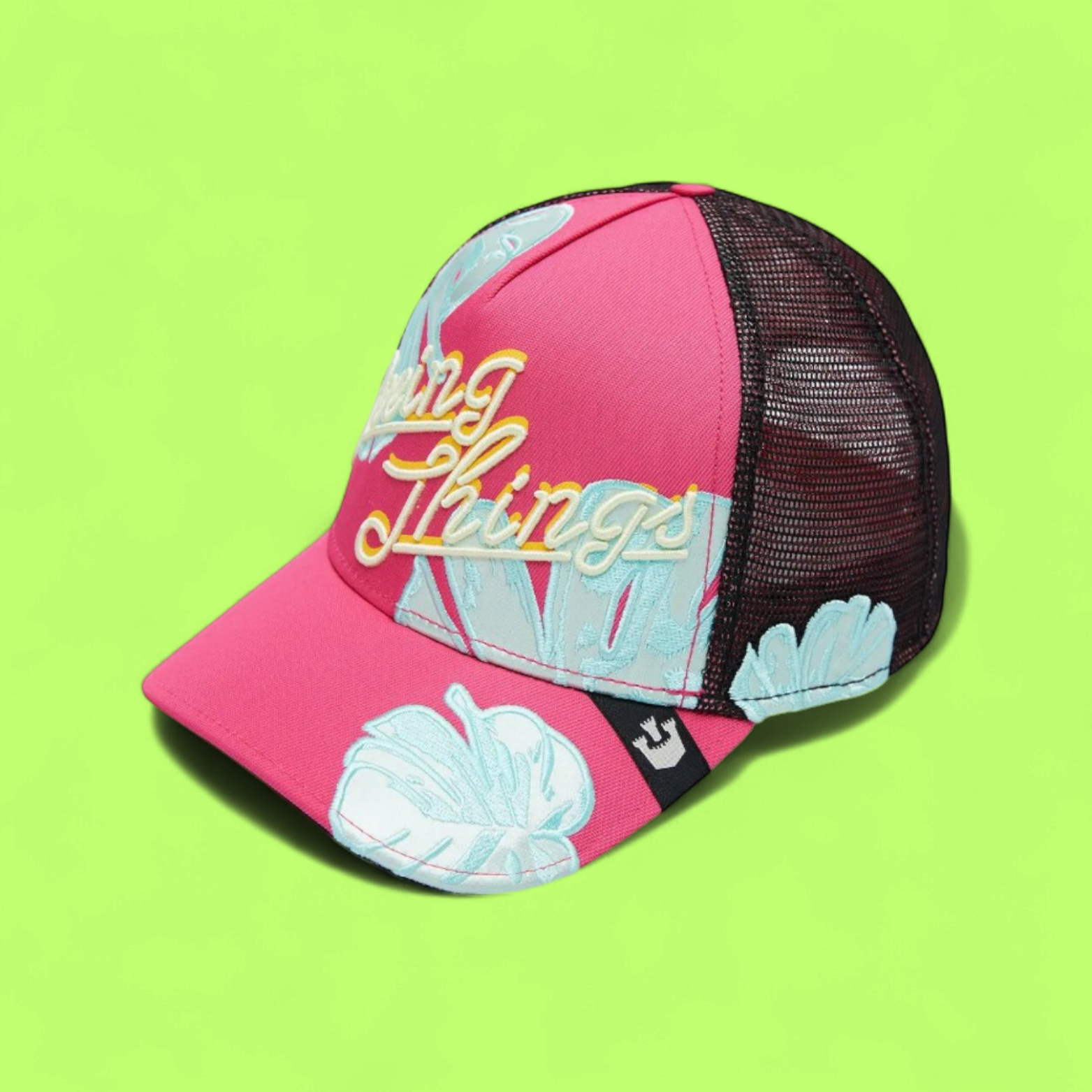 PINK TRUCKER CAP WITH BLUE LEAF DETAILS AND YELLOW TEXT CWCDE