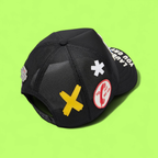 BLACK TRUCKER CAP WITH CLOWN PATCH AND BOLD SLOGAN