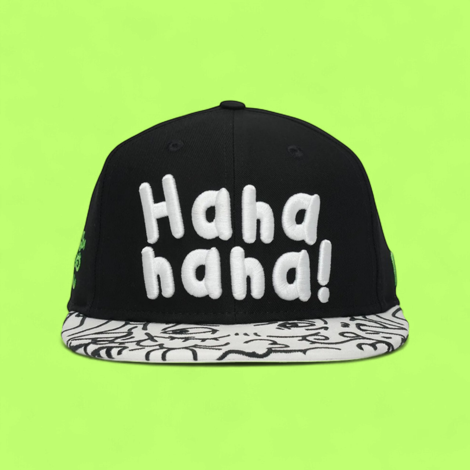 BLACK SNAPBACK CAP WITH WHITE LETTERS AND PATTERNED VISOR