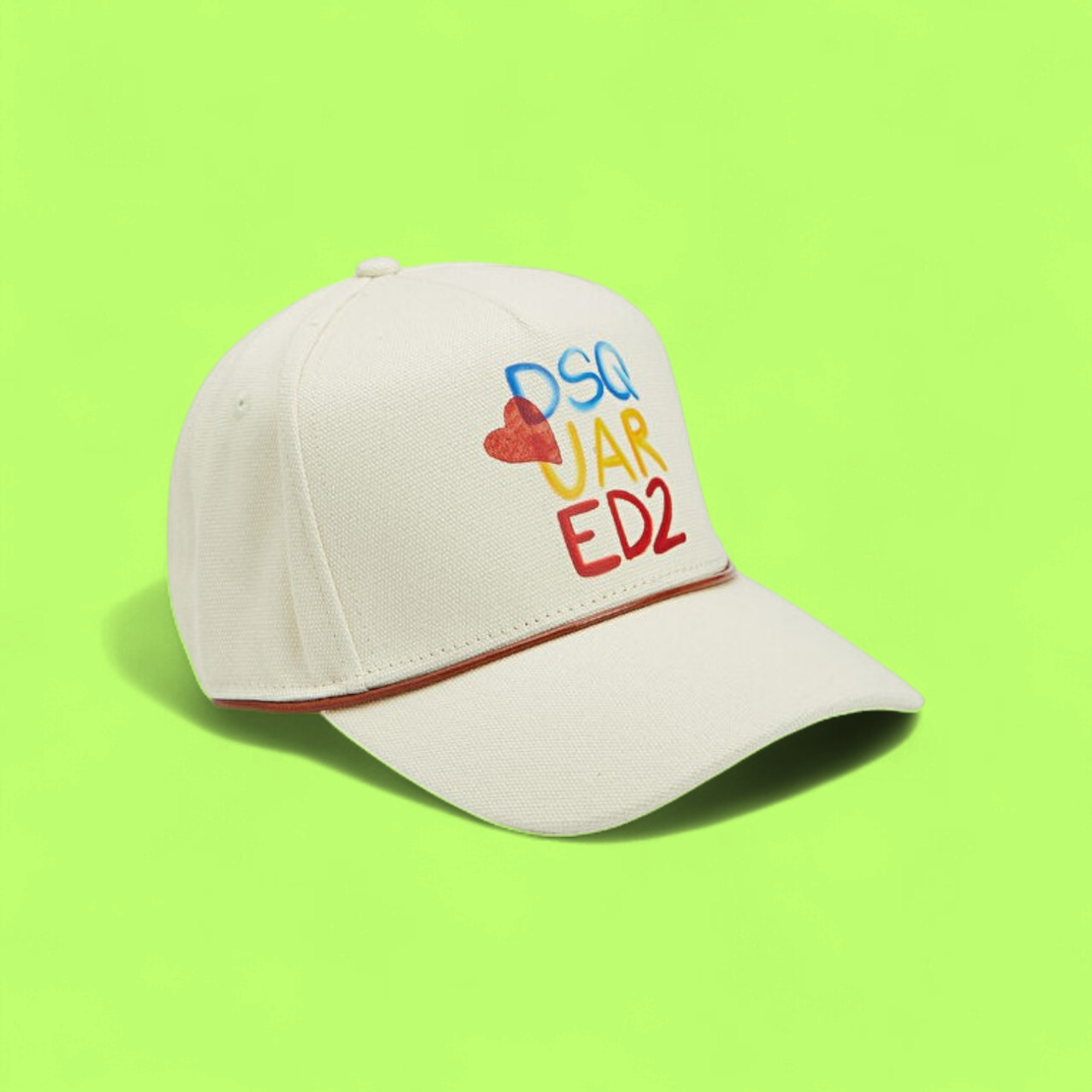 CREAM CAP WITH COLORFUL PRINTED DESIGN AND HEART DETAIL