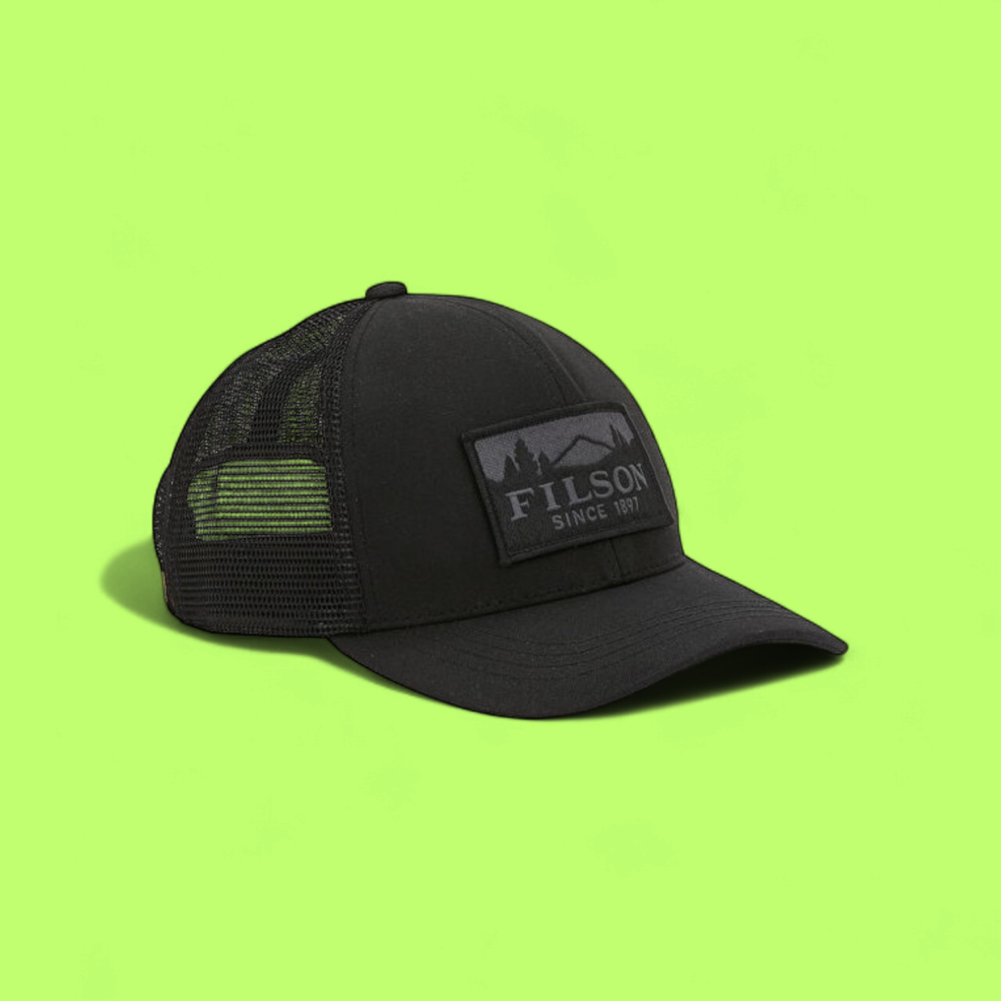 FILSON ALL BLACK OUTDOOR MESH TRUCKER HAT SINCE 1897 LOGO