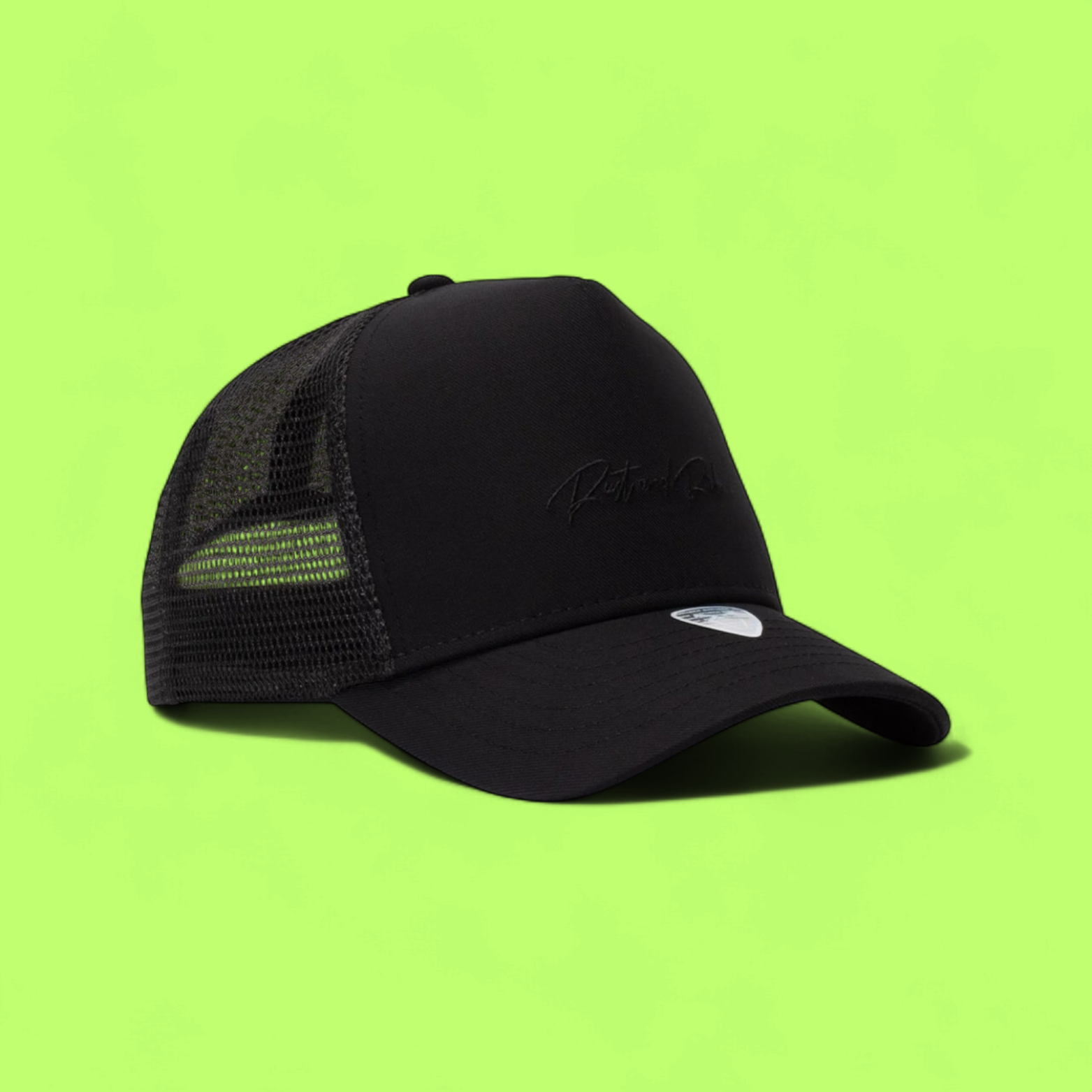 BLACK TRUCKER CAP WITH MINIMAL TONE ON TONE EMBROIDERY
