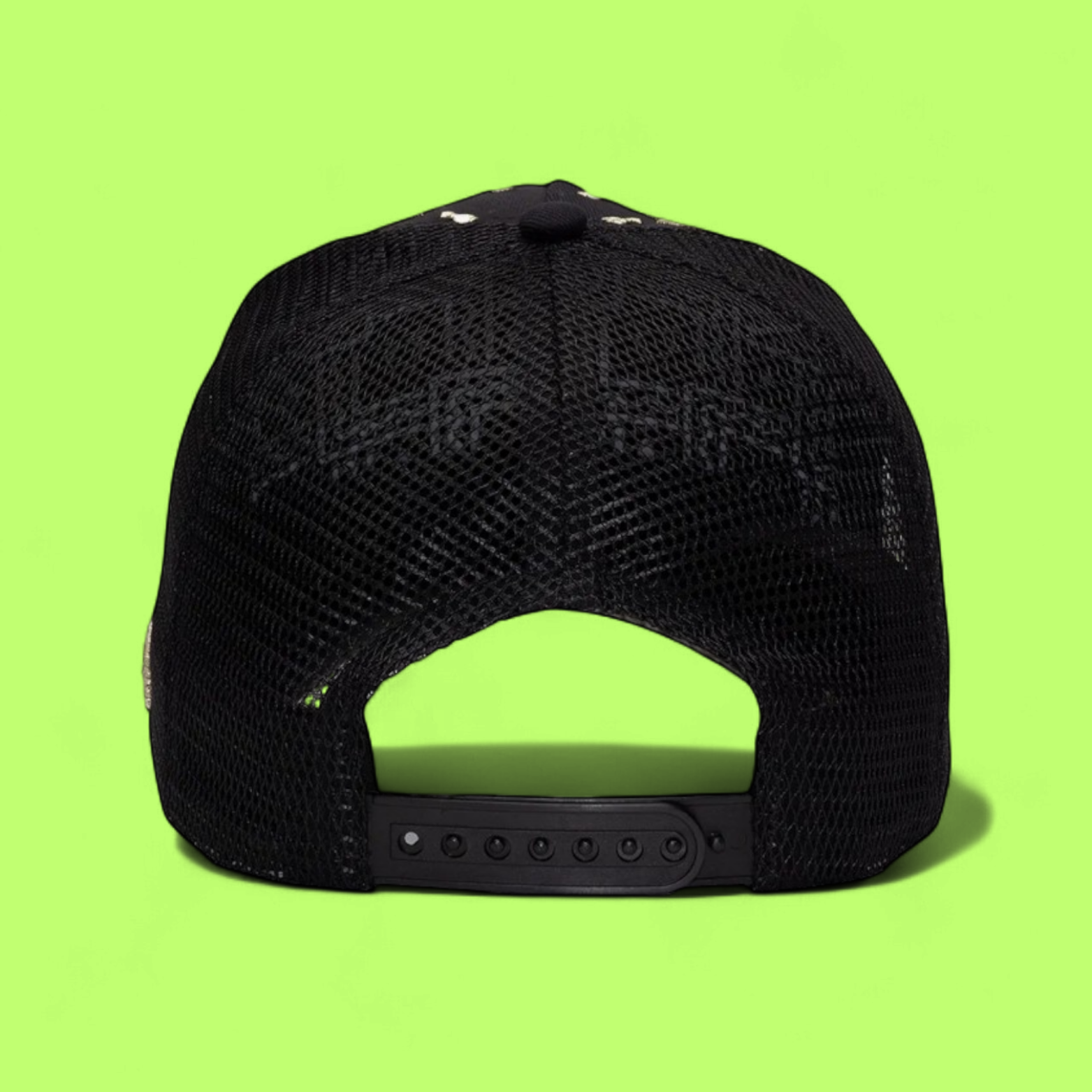 BLACK TRUCKER CAP WITH GOLDEN R LOGO AND FLORAL PATTERN