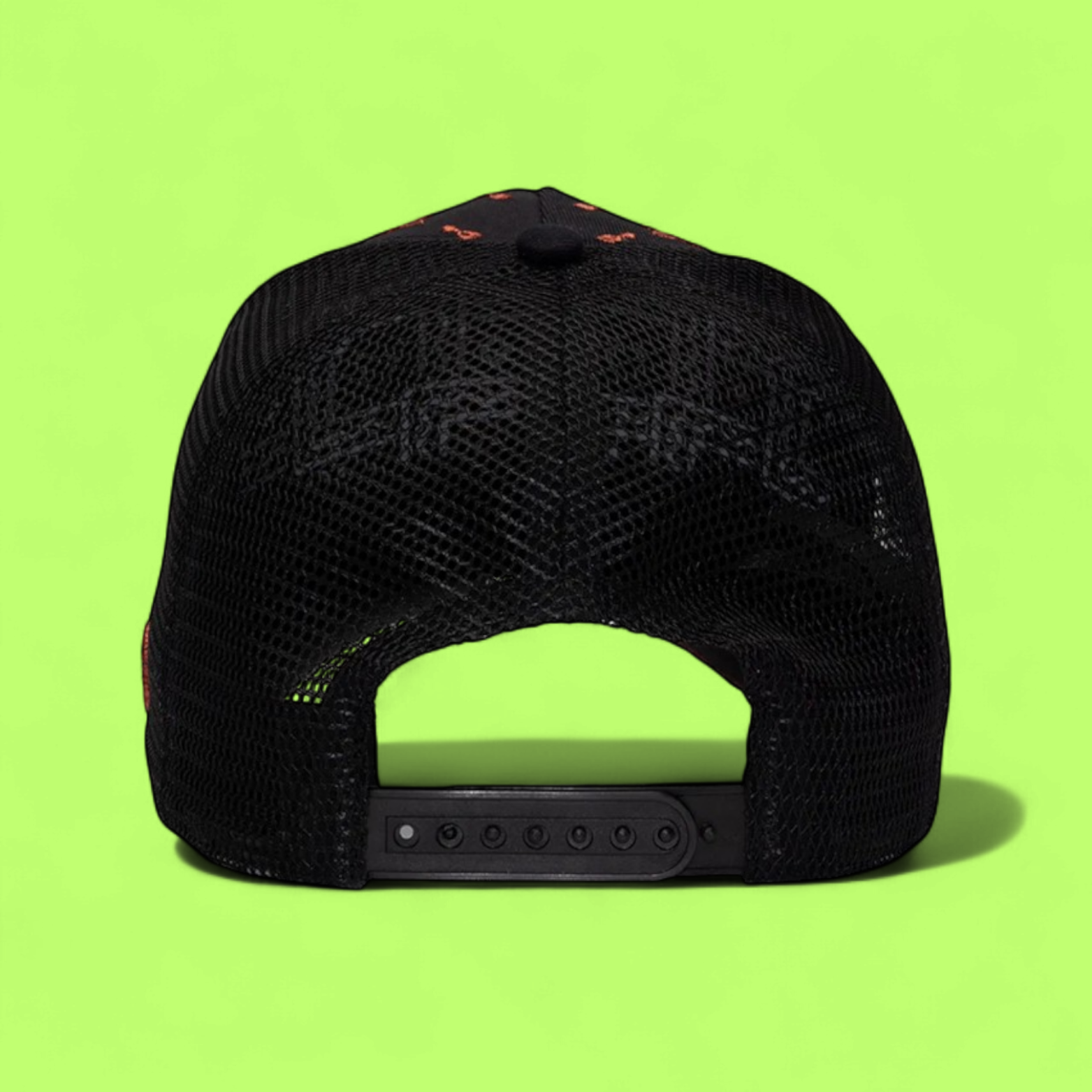 BLACK TRUCKER CAP WITH ORANGE R LOGO AND FLORAL PATTERN